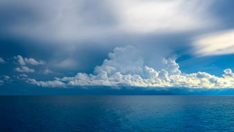 Deep blue Atlantic Ocean with clouds