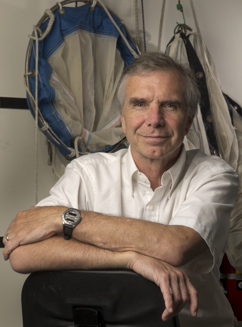 Mike Roman, sitting in front of research gear