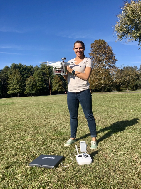 Anna Windle holding a drone