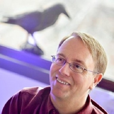 Dr. Kevin Omland with bird in background 