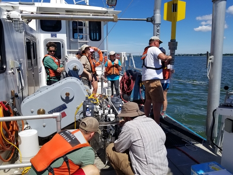 Scientists work on a busy research vessel