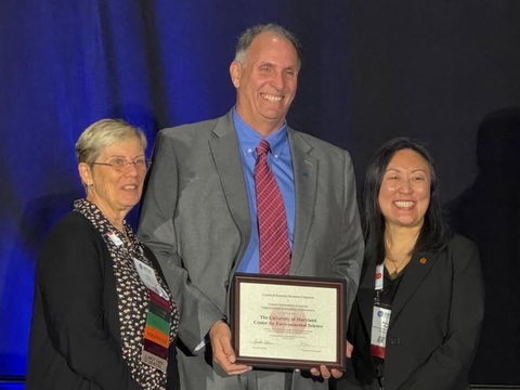 UMCES President Fernando Miralles-Wilhelm holds the certificate for the Coastal Stewardship Award.