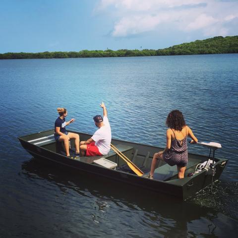 Students on a boat look out to sea