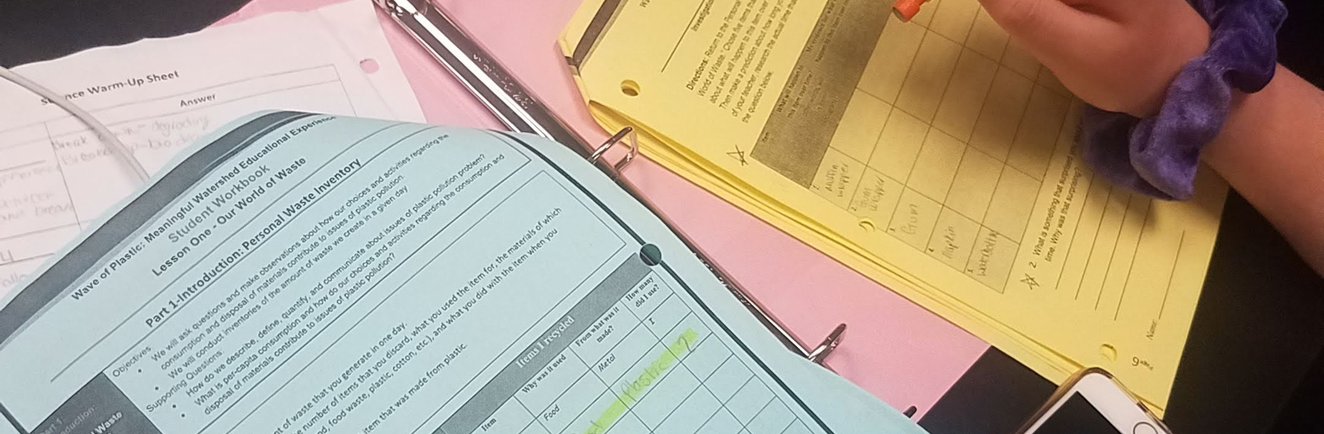 close up image of a school binder and work