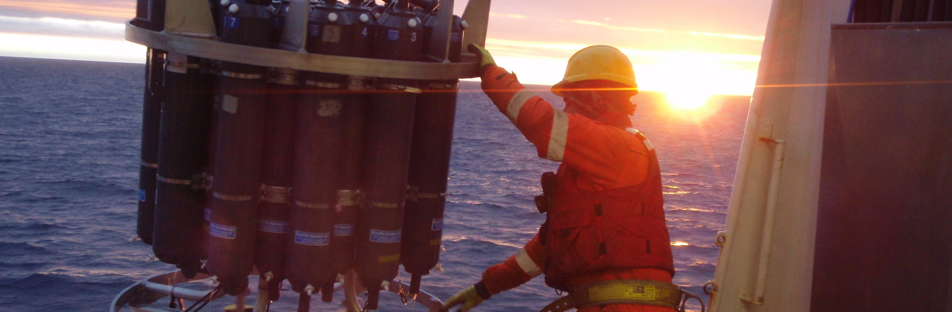 A CBL alumni working with a CTD Machine in the Arctic