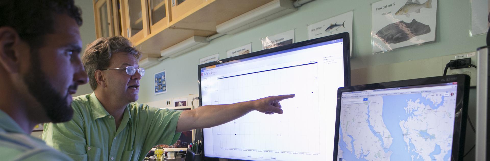 Professor Dave Secor points on rockfish migration patterns on a computer monitor.