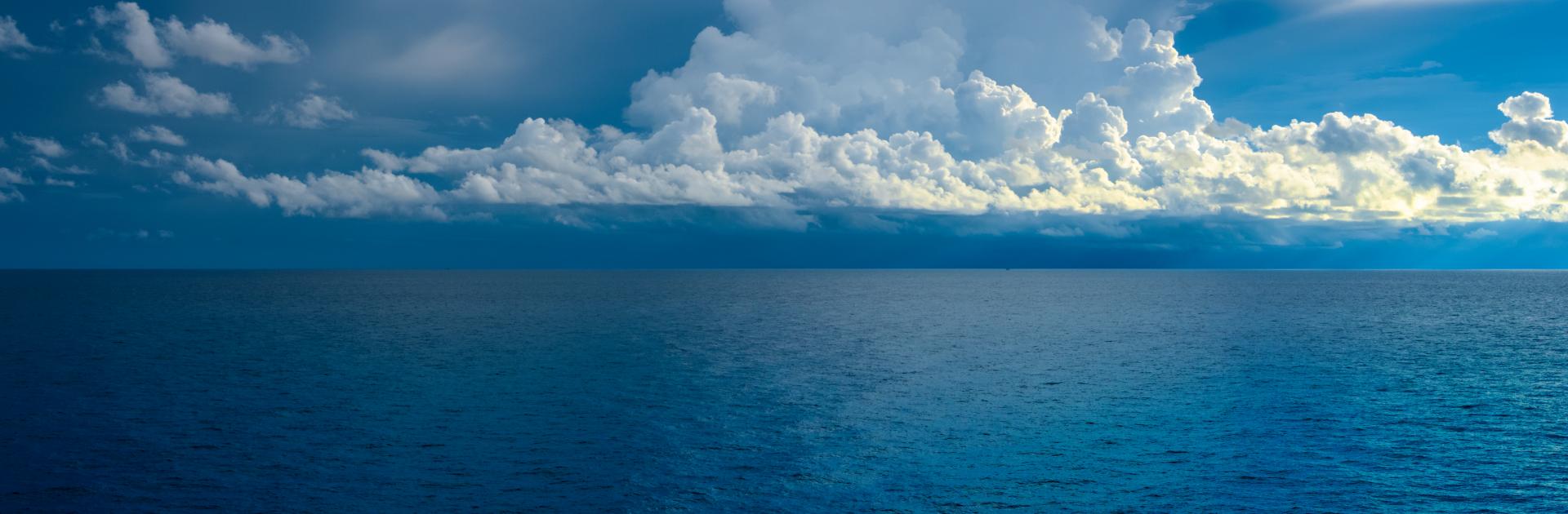Deep blue Atlantic Ocean with clouds