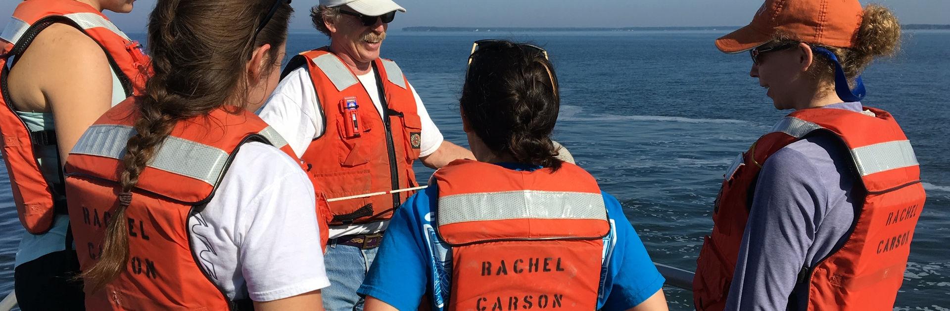 Professor Raleigh Hood talks to one group about measuring water quality.