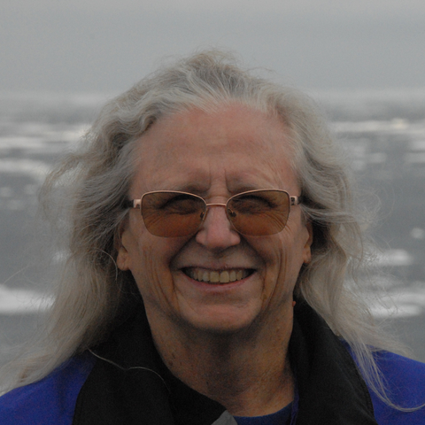 Photo of Jackie Grebmeier with sea ice background