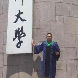 Tao Wang in graduation robes