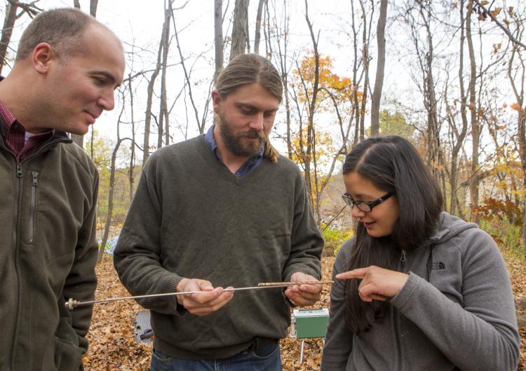 David Nelson and Andrew Elmore teach a student. 