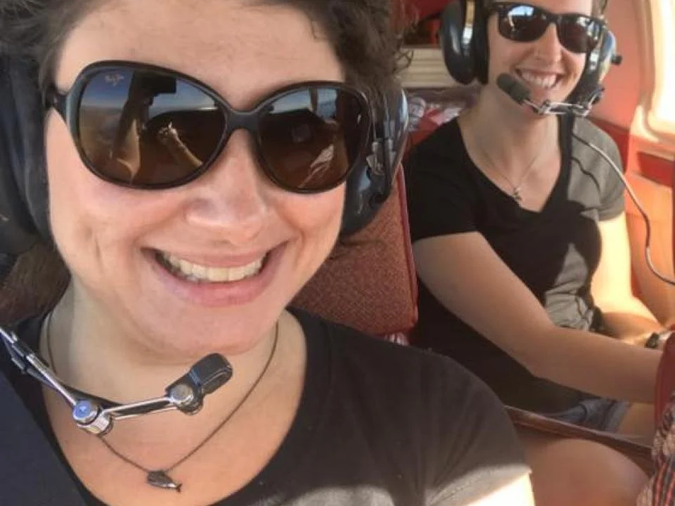 Research assistants Amber Fandel and Leila Fouda ready for their flight.