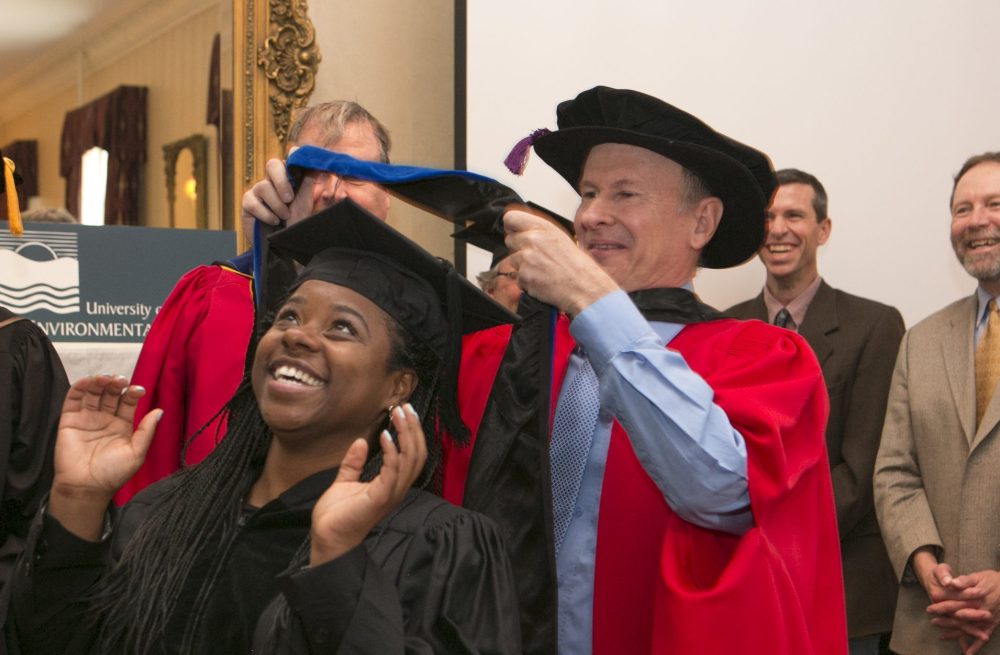 An UMCES graduate receives her hood