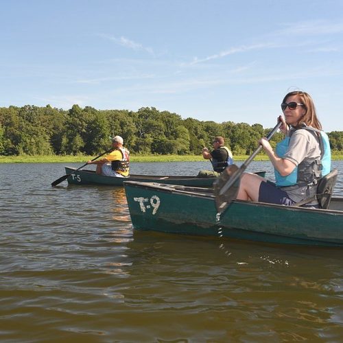 Visitors canoeing on open water in Tuckahoe State Park, Maryland.