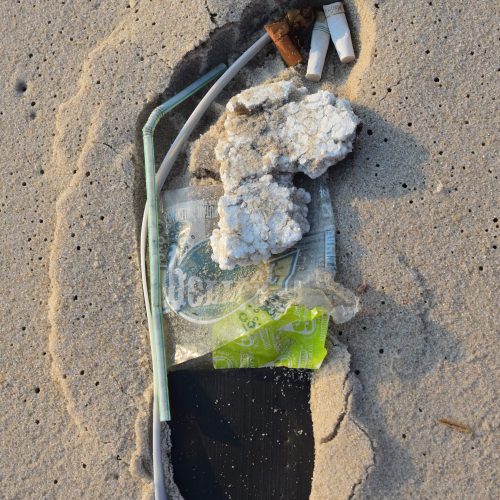 plastic filling a footprint of plastic on the beach