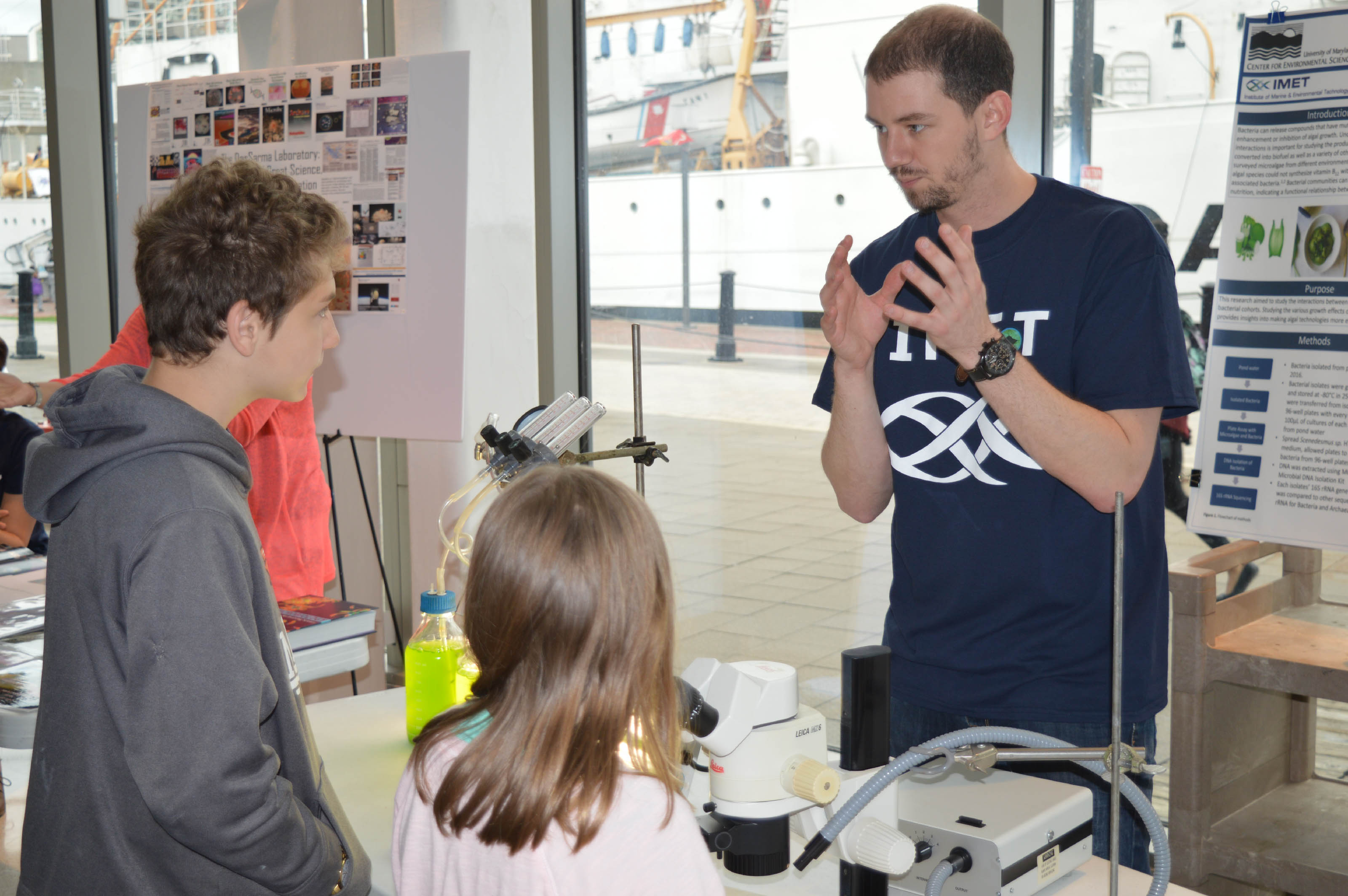 Sam Major talks about his research at IMET during the Open House. 