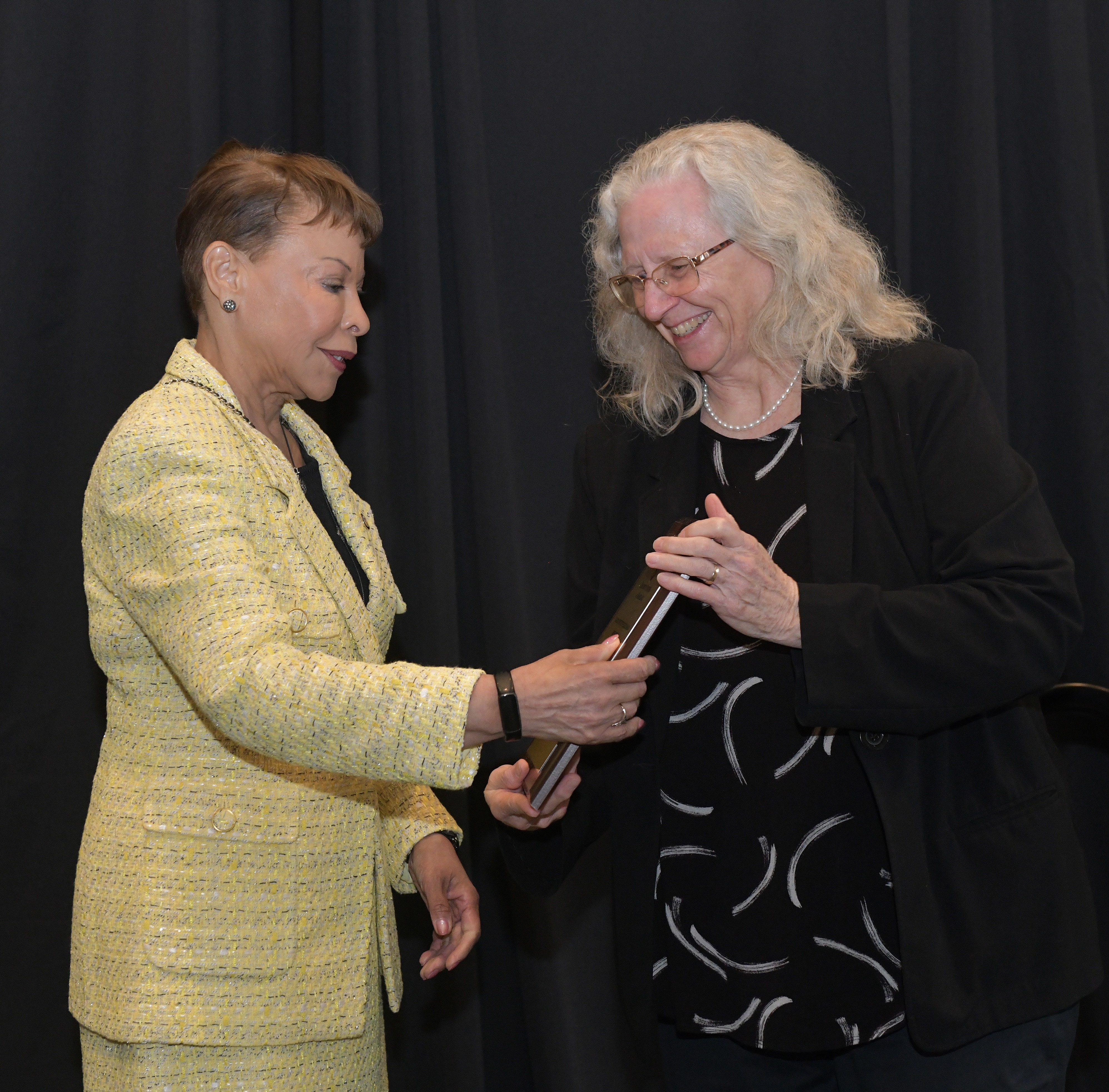 Jacqueline Grebmeier receiving her award from the USM Board of Regents Chair, Linda Gooden, for excellence in Arctic sciences research. Credit: Thomas Nappi.
