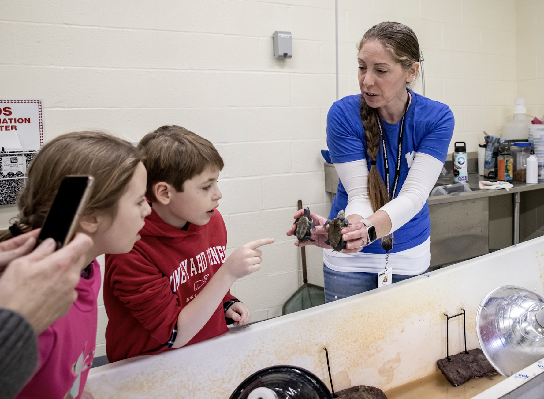 Kids attending the CBL centennial celebration tour the terrapin nursery.