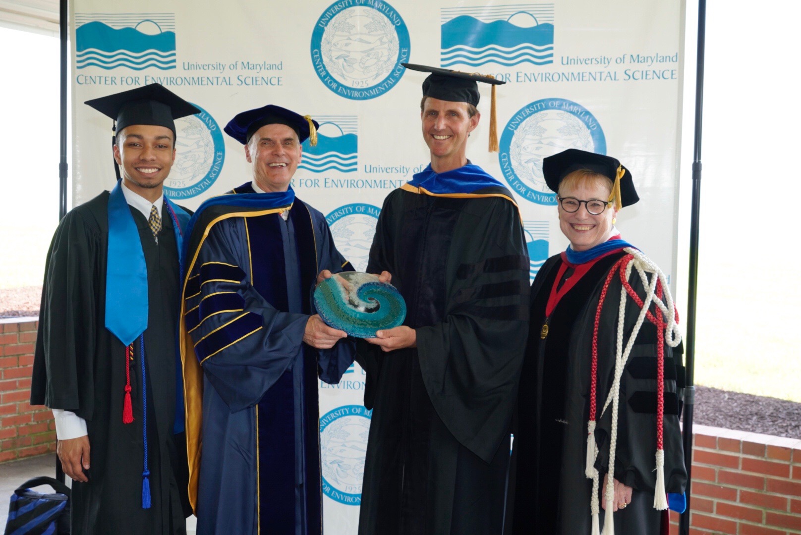 USM Student Regent William "Will" Shorter, Jr. UMCES President Peter Goodwin, keynote speaker RMDL Tim Gallaudet, and Vice Chancellor Joann Boughman