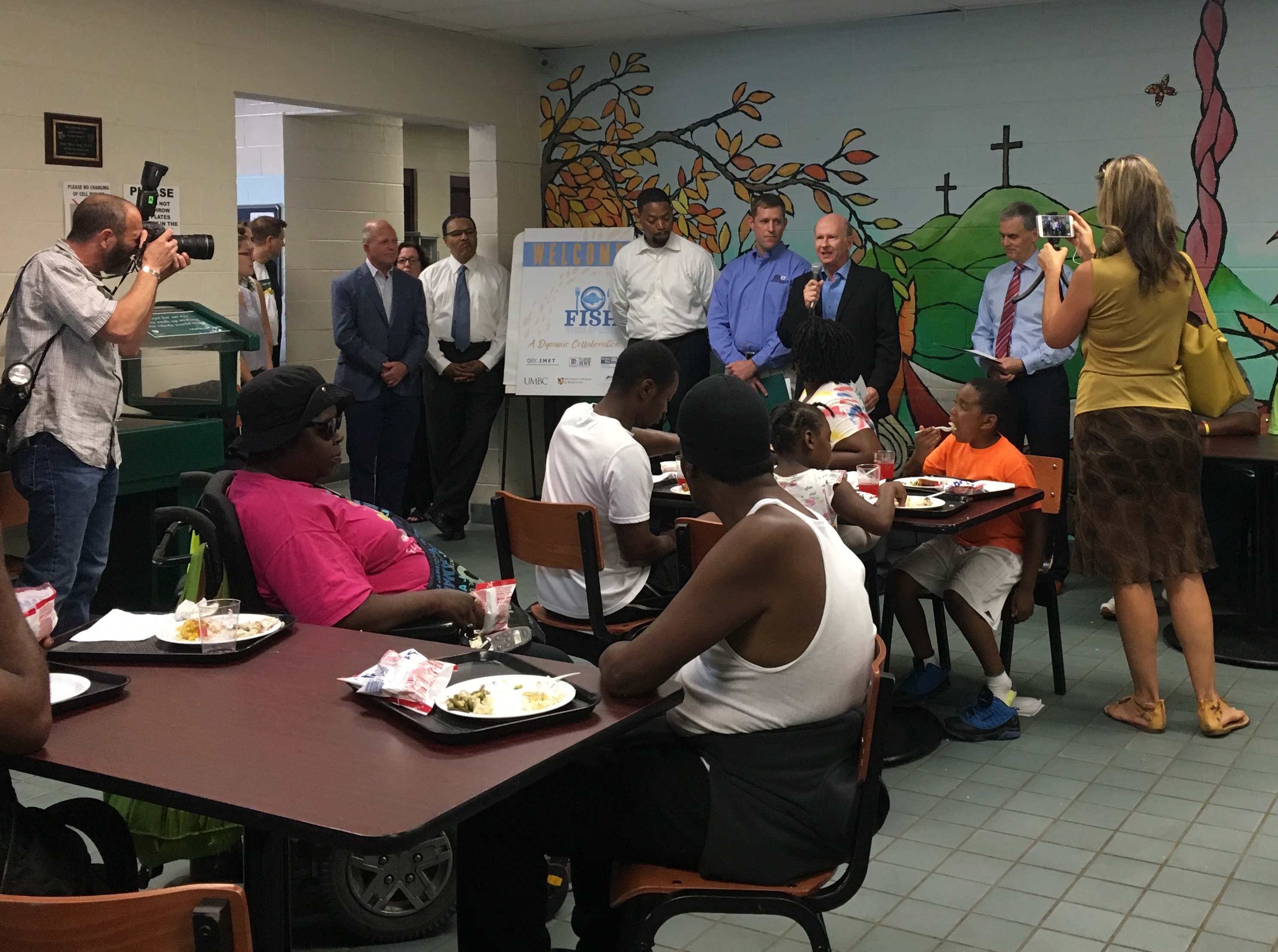 IMET Director Russell Hill announces FISH Project at The Franciscan Center in Baltimore.