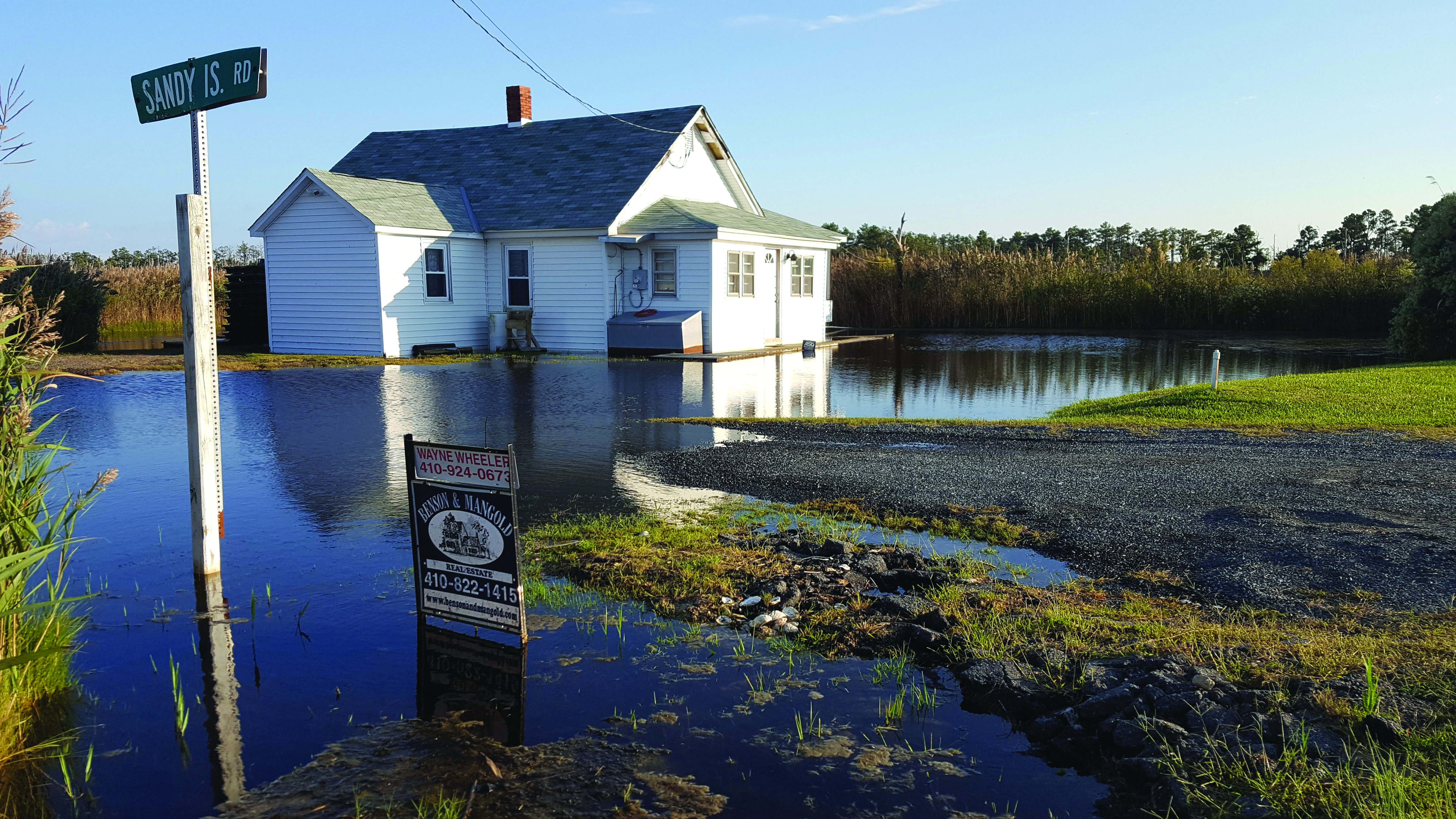 House surrounded by rising waters