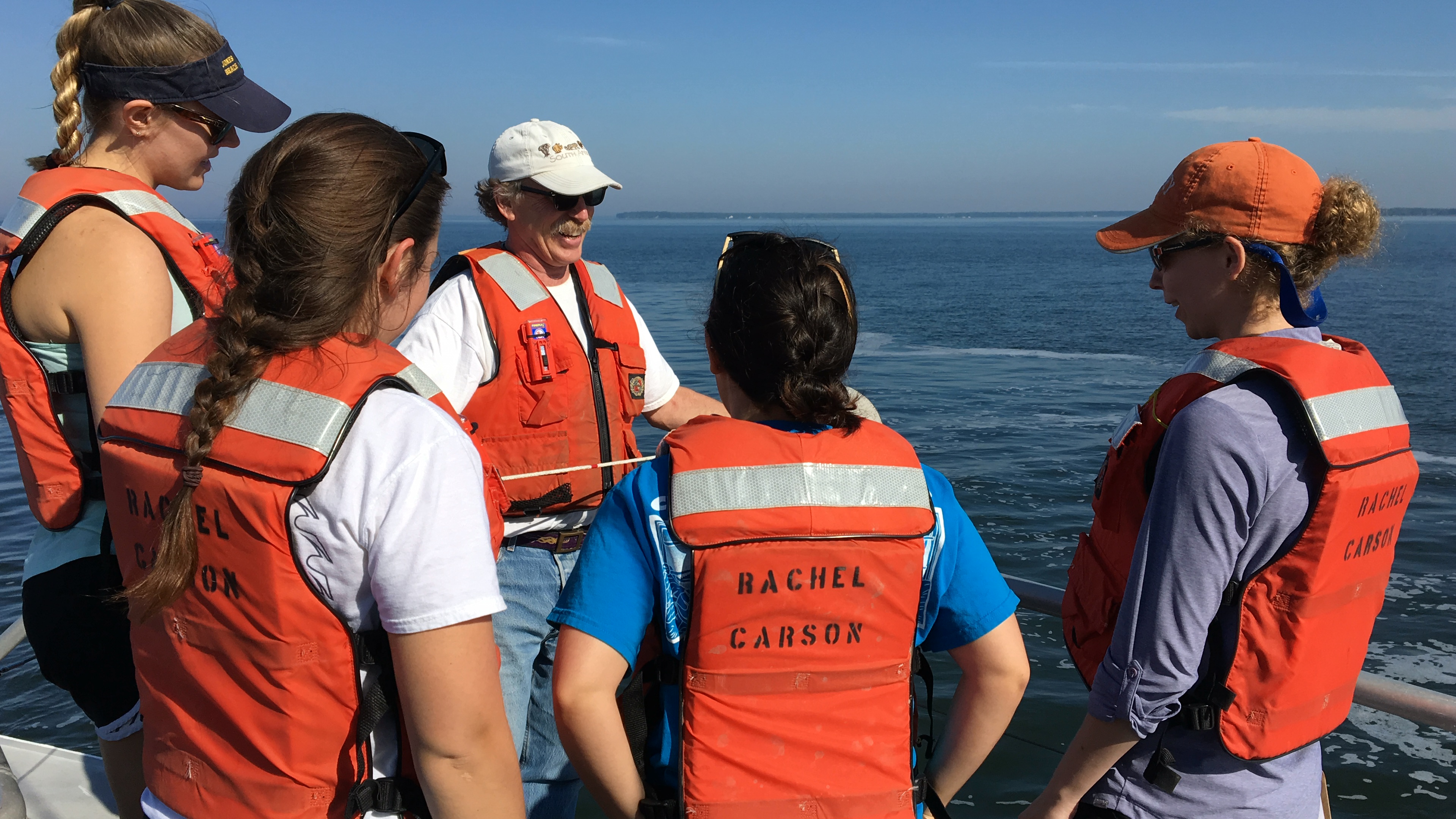 Professor Raleigh Hood talks to one group about measuring water quality.